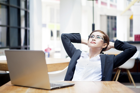 businesswoman relaxing as she works